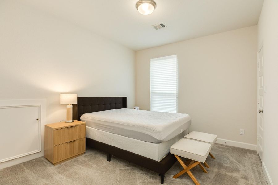 This second bedroom, located on the upper level, offers generous square footage and features a spacious n closet. Additionally, the room provides convenient access to the attic, allowing for extra storage or utility needs. This second bedroom, located on the upper level, offers generous square footage and features a spacious n closet. Additionally, the room provides convenient access to the attic, allowing for extra storage or utility needs.