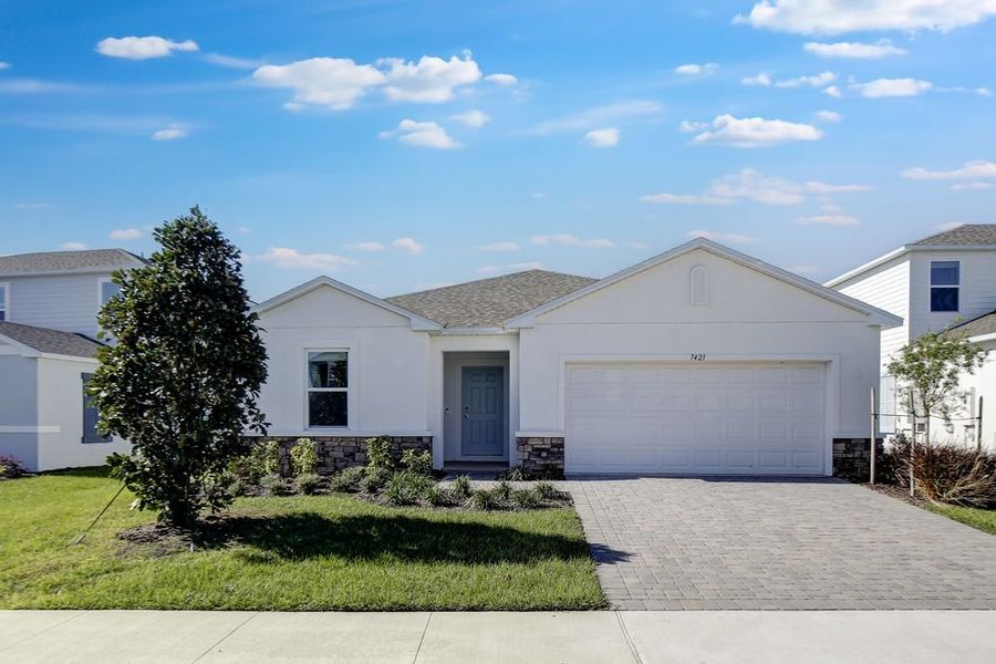Representative exterior photo of a completed home built from the Cypress by Taylor Morrison in Waterstone, Groveland, FL (Image 1).