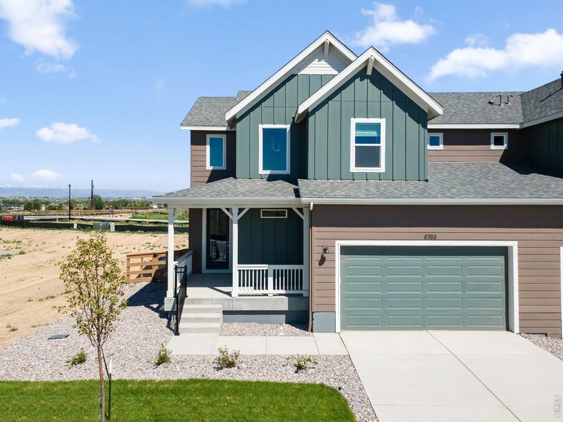 Front exterior of a new home in Cordovan, Longmont, CO, highlighting curb appeal (Image 1). Front exterior of a new home in Cordovan, Longmont, CO, highlighting curb appeal (Image 1).