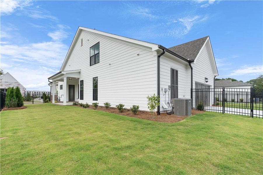 Front exterior of a new home in Promenade at Sawnee Village, Cumming, GA, highlighting curb appeal (Image 26).