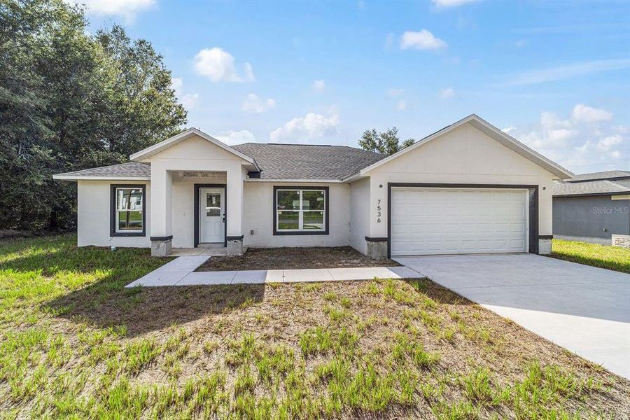 Front exterior of a new home in , Ocala, FL, highlighting curb appeal (Image 11).