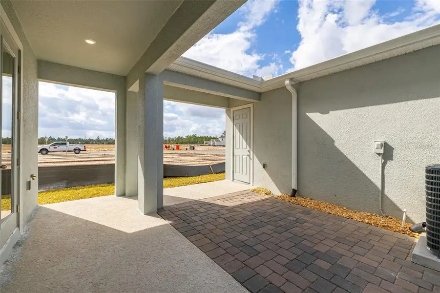 Exterior details and patio area of a home in Serenade at Ovation, Winter Garden (Image 16). Exterior details and patio area of a home in Serenade at Ovation, Winter Garden (Image 16).