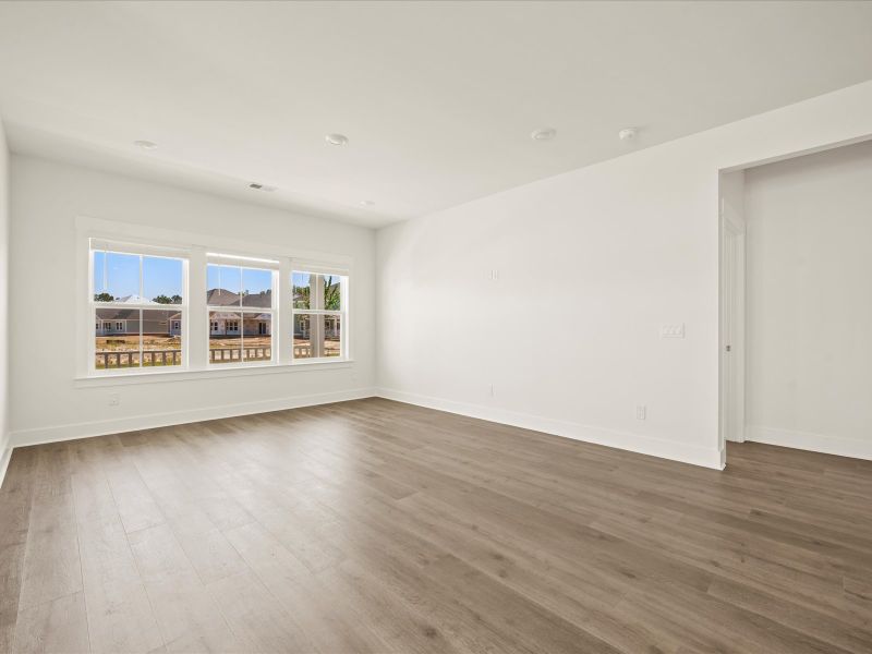 Spacious, unfurnished interior of a new home in The Coves at Lakes of Cane Bay, Summerville (Image 19).