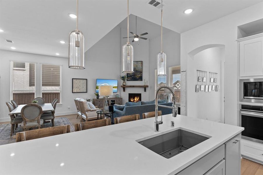 Love the pretty pendant lights + the open flow to the living - dining rooms....ideal for hosting family & friends. Love the pretty pendant lights + the open flow to the living - dining rooms....ideal for hosting family & friends.