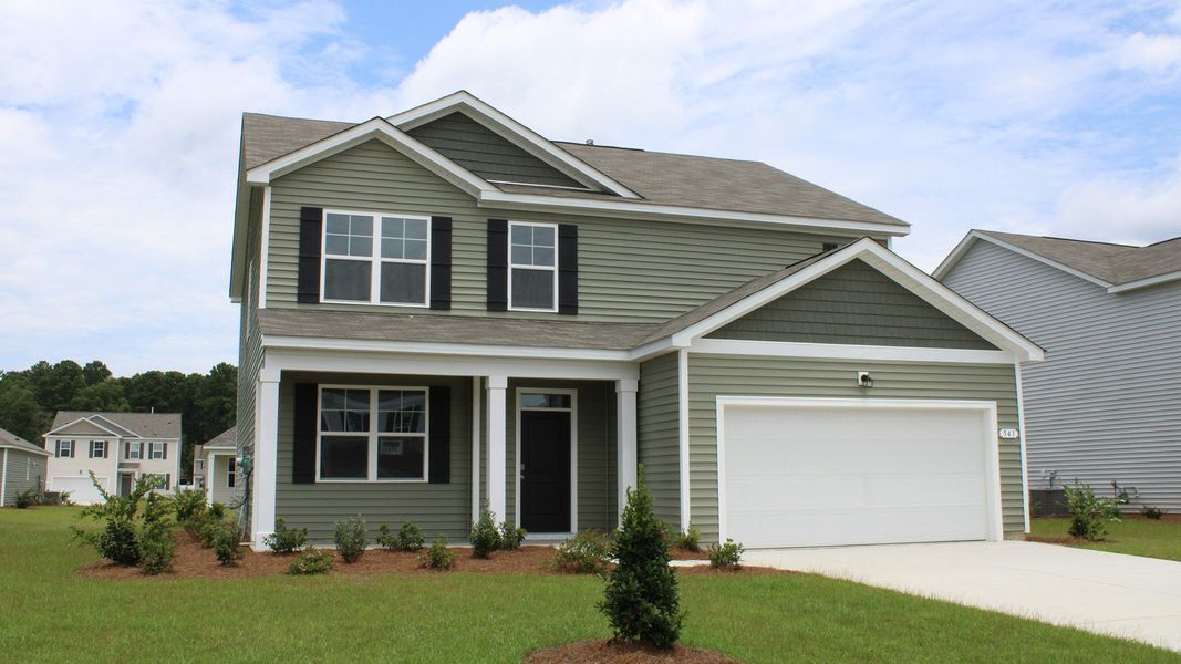 Front exterior of a new home in Sandridge Park, Little River, SC, highlighting curb appeal (Image 21).