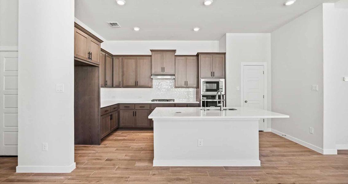 Furnished interior view inside a new home in Trace, San Marcos (Image 6).
