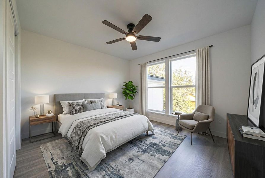 Bedroom with wood finished floors and ceiling fan