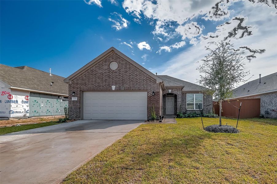 Front exterior of a new home in Lago Mar, Texas City, TX, highlighting curb appeal (Image 2). Front exterior of a new home in Lago Mar, Texas City, TX, highlighting curb appeal (Image 2).