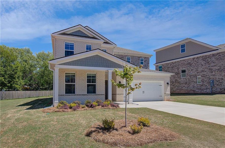 Front exterior of a new home in Bowers Farm, McDonough, GA, highlighting curb appeal (Image 1). Front exterior of a new home in Bowers Farm, McDonough, GA, highlighting curb appeal (Image 1).