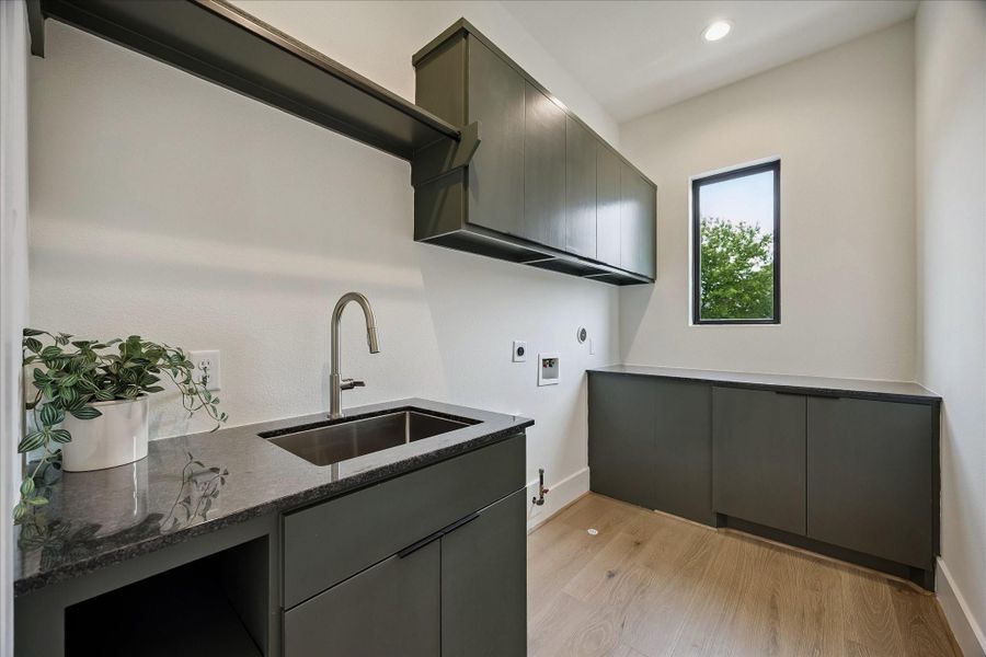 Utility room - custom built-ins, lots of counter space sink. Utility room - custom built-ins, lots of counter space sink.
