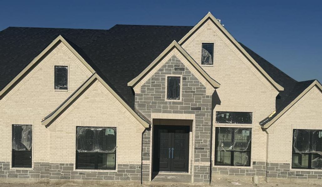 Front exterior of a new home in , Aledo, TX, highlighting curb appeal (Image 1).