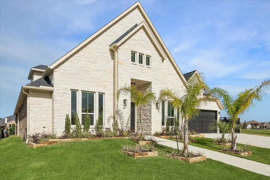 Front exterior of a new home in , Kemah, TX, highlighting curb appeal (Image 24).