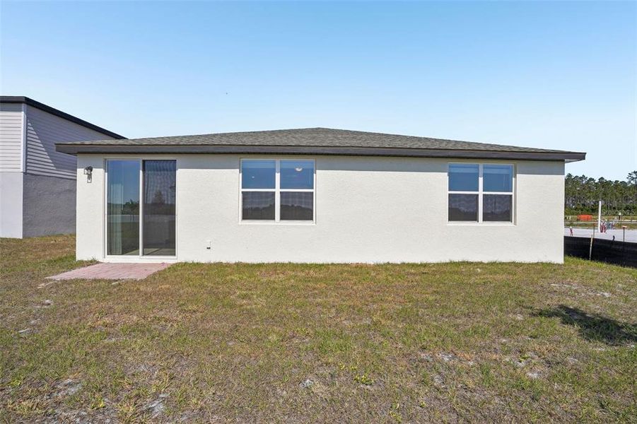 Exterior details and patio area of a home in Lake Deer Estates - Signature Series, Poinciana (Image 23). Exterior details and patio area of a home in Lake Deer Estates - Signature Series, Poinciana (Image 23).