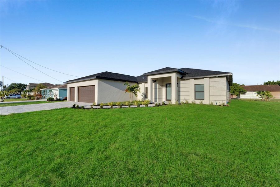 Front exterior of a new home in , Cape Coral, FL, highlighting curb appeal (Image 2). Front exterior of a new home in , Cape Coral, FL, highlighting curb appeal (Image 2).