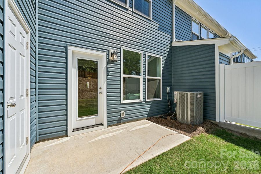 Model Home - Rear Patio with Outdoor Shed & Privacy Partitions. Model Home - Rear Patio with Outdoor Shed & Privacy Partitions.