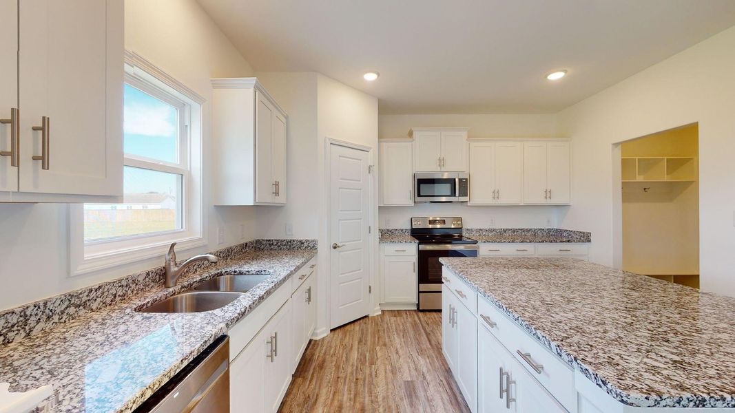 Representative furnished interior of a home built from the Yorkshire A by JC Jackson Homes,LLC in Heritage Pointe, Newport (Image 9).
