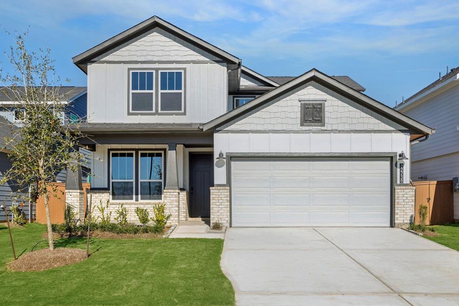 Front exterior of a new home in Elyson, Katy, TX, highlighting curb appeal (Image 1). Front exterior of a new home in Elyson, Katy, TX, highlighting curb appeal (Image 1).
