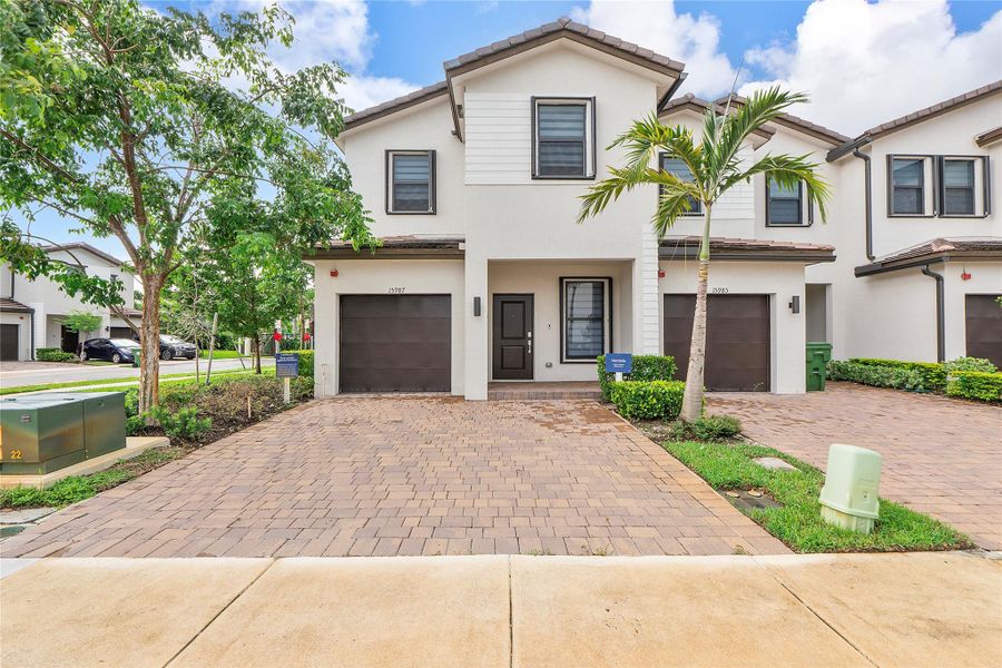 Front exterior of a new home in , Pembroke Pines, FL, highlighting curb appeal (Image 22).