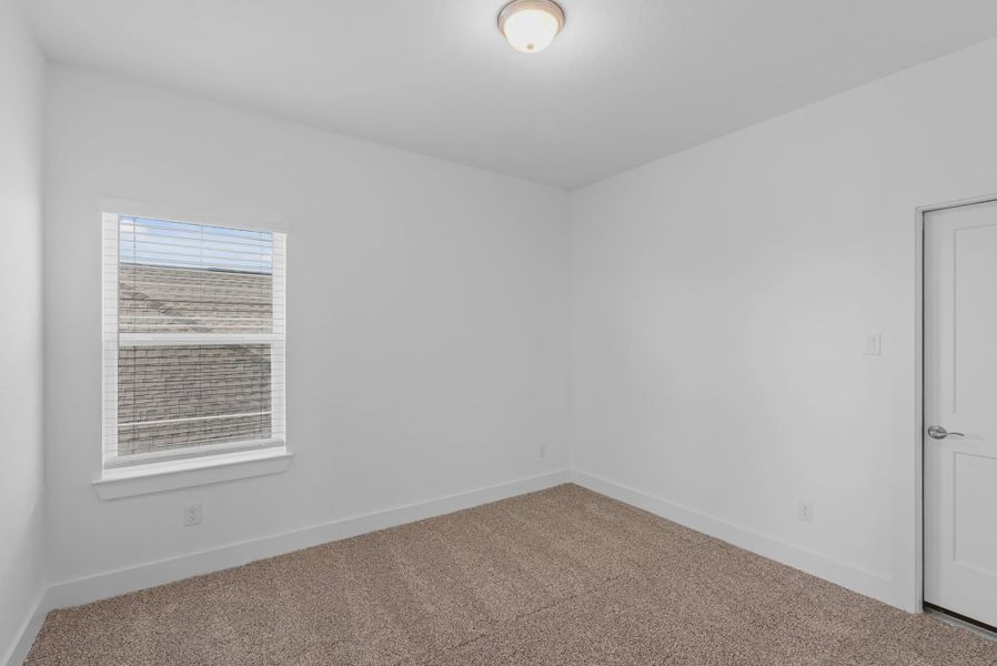 Representative unfurnished interior of a home built from the St Andrews by Chesmar Homes in Riceland Alley Loads, Mont Belvieu (Image 44).