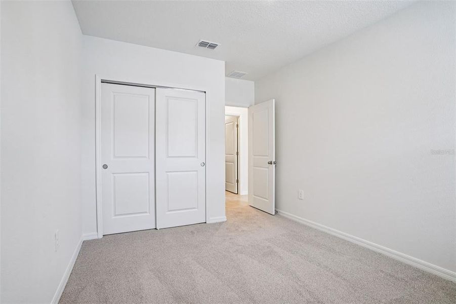 Spacious, unfurnished interior of a new home in Ridgehaven - Villas, Ormond Beach (Image 31).