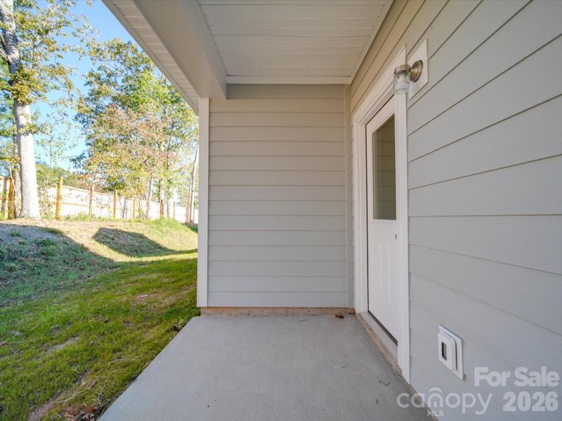 Exterior details and patio area of a home in , Belmont (Image 3).
