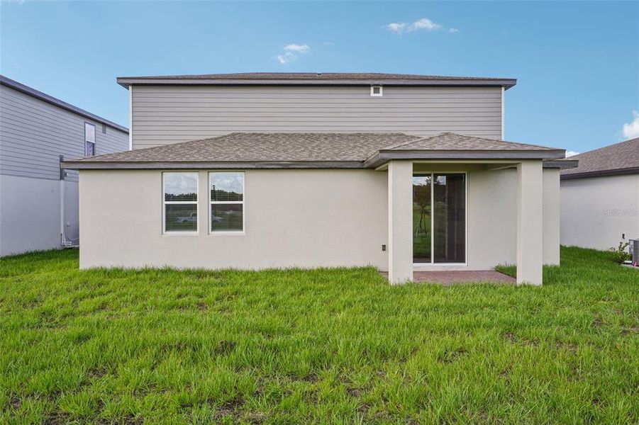 Exterior details and patio area of a home in The Meadow at Crossprairie, St. Cloud (Image 25).