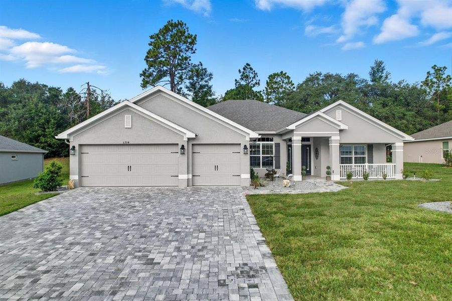 Front exterior of a new home in , Dunnellon, FL, highlighting curb appeal (Image 1).
