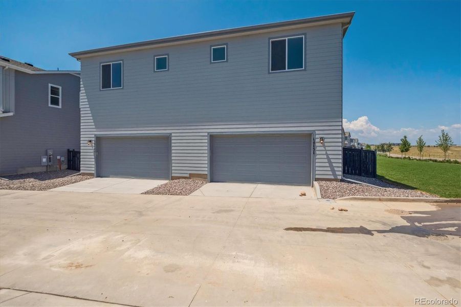 Front exterior of a new home in Paired Homes at Alder Creek, Parker, CO, highlighting curb appeal (Image 1). Front exterior of a new home in Paired Homes at Alder Creek, Parker, CO, highlighting curb appeal (Image 1).
