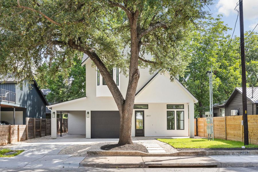 View of front of home featuring concrete driveway and an attached garage View of front of home featuring concrete driveway and an attached garage