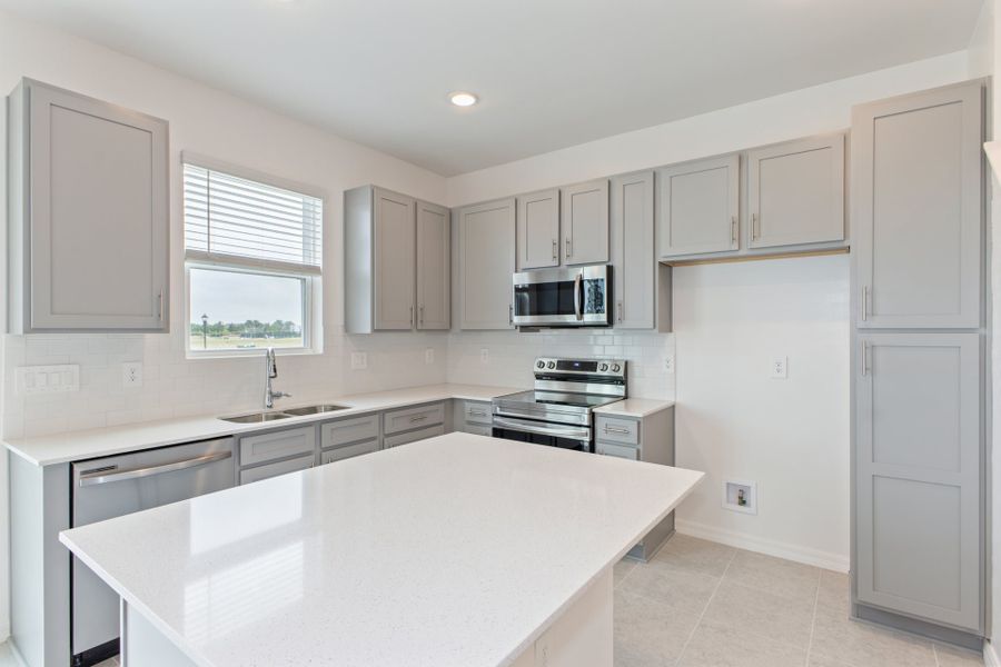 Representative furnished interior of a home built from the Carter by Park Square Residential in Townwalk at Babcock Ranch, Punta Gorda (Image 5).