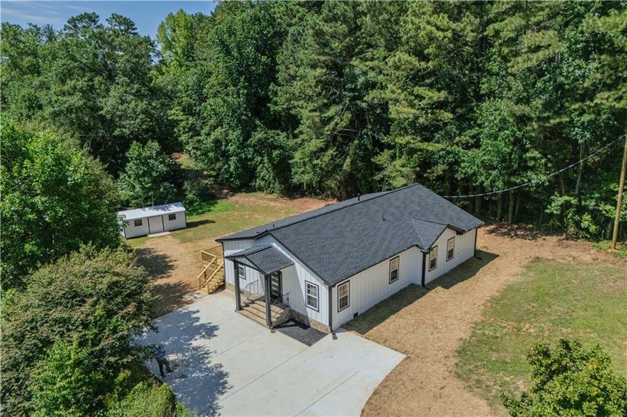 Front exterior of a new home in , Woodstock, GA, highlighting curb appeal (Image 22).