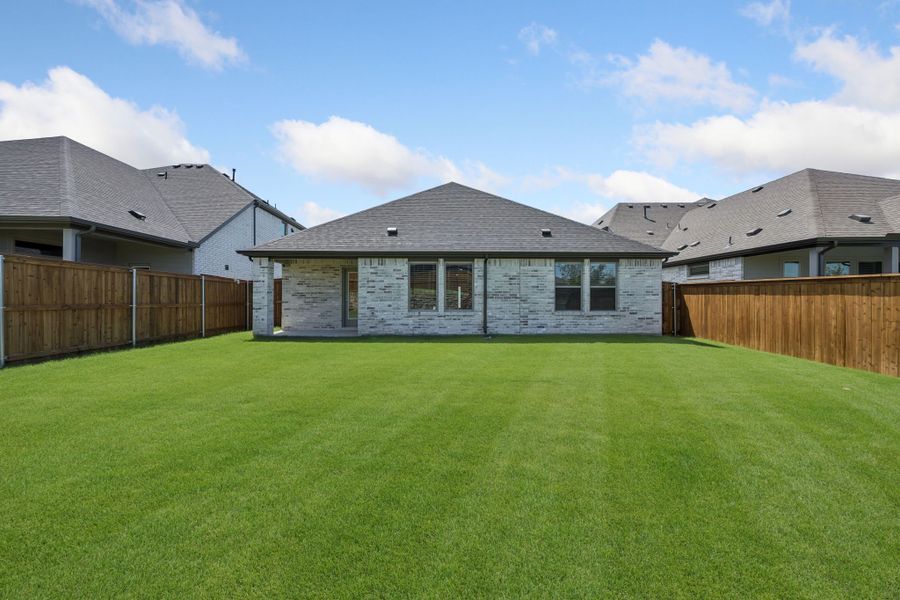 Covered patio in the Heisman home plan by Trophy Signature Homes – REPRESENTATIVE PHOTO Covered patio in the Heisman home plan by Trophy Signature Homes – REPRESENTATIVE PHOTO