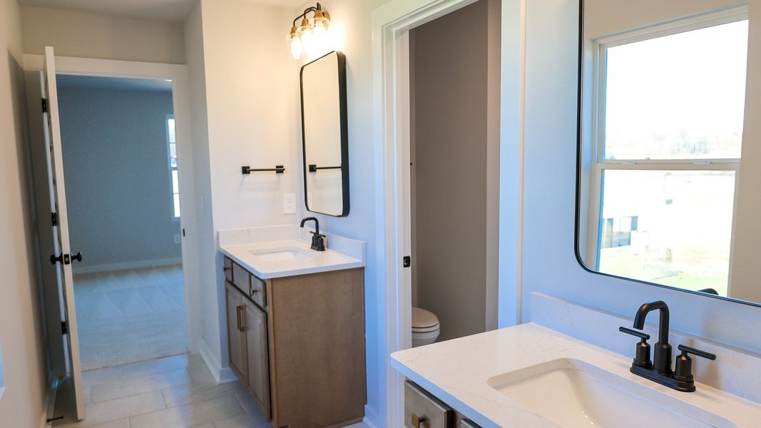 Representative furnished interior of a home built from the STONEBROOK II by D.R. Horton in Harvest Point, Spring Hill (Image 20).