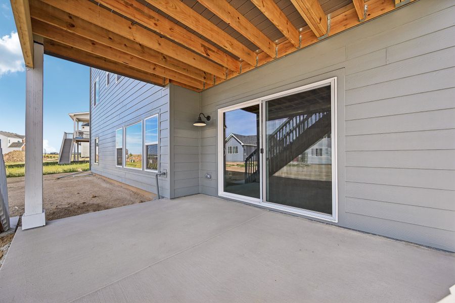 Exterior details and patio area of a home in The Aurora Highlands, Aurora (Image 17).