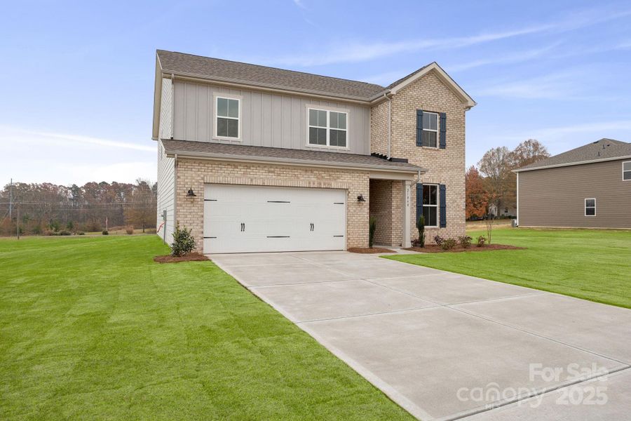 Front exterior of a new home in Running Creek, Locust, NC, highlighting curb appeal (Image 5). Front exterior of a new home in Running Creek, Locust, NC, highlighting curb appeal (Image 5).