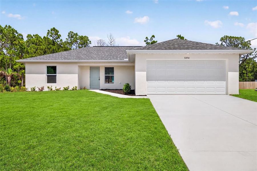 Front exterior of a new home in , Port Charlotte, FL, highlighting curb appeal (Image 1). Front exterior of a new home in , Port Charlotte, FL, highlighting curb appeal (Image 1).