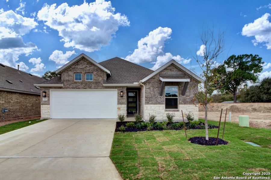 Front exterior of a new home in Clear Creek, New Braunfels, TX, highlighting curb appeal (Image 1). Front exterior of a new home in Clear Creek, New Braunfels, TX, highlighting curb appeal (Image 1).