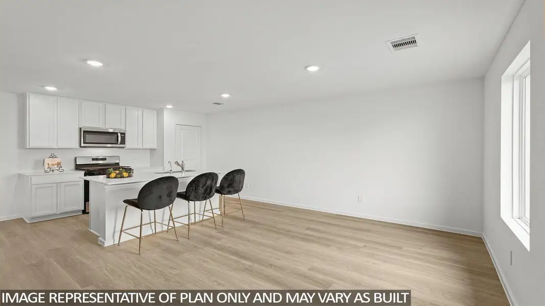 Furnished interior view inside a new home in Sunterra, Katy (Image 5).