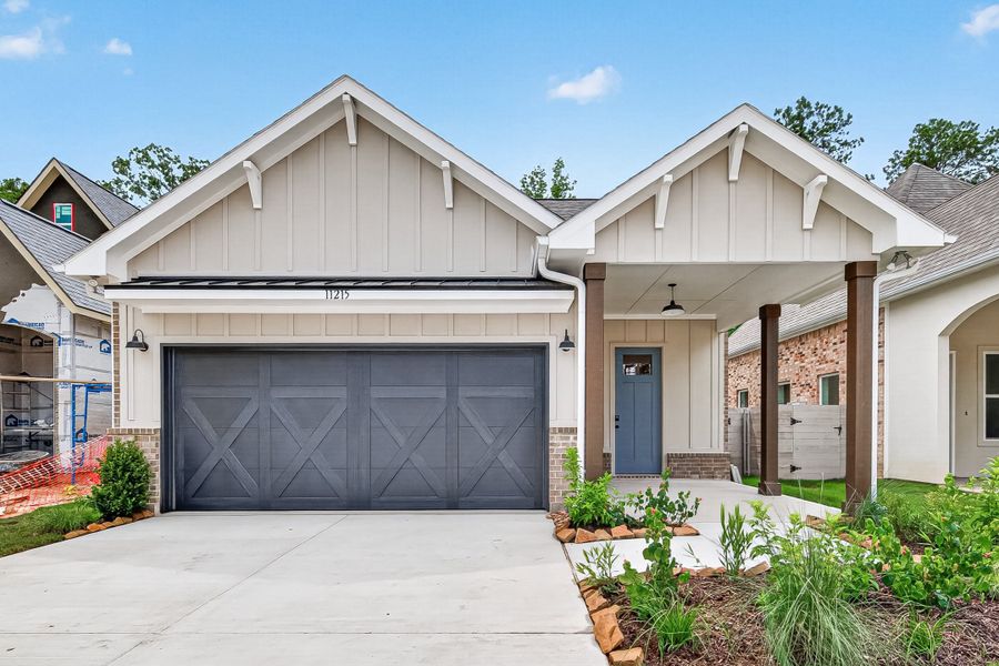 Front exterior of a new home in Two Step Farm, Montgomery, TX, highlighting curb appeal (Image 2). Front exterior of a new home in Two Step Farm, Montgomery, TX, highlighting curb appeal (Image 2).