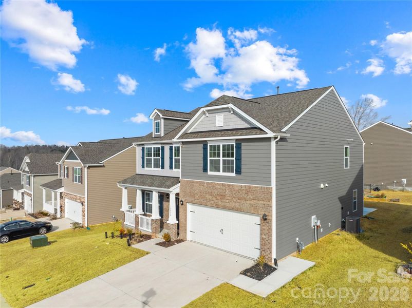 Front exterior of a new home in Adair Woods, Davidson, NC, highlighting curb appeal (Image 27). Front exterior of a new home in Adair Woods, Davidson, NC, highlighting curb appeal (Image 27).