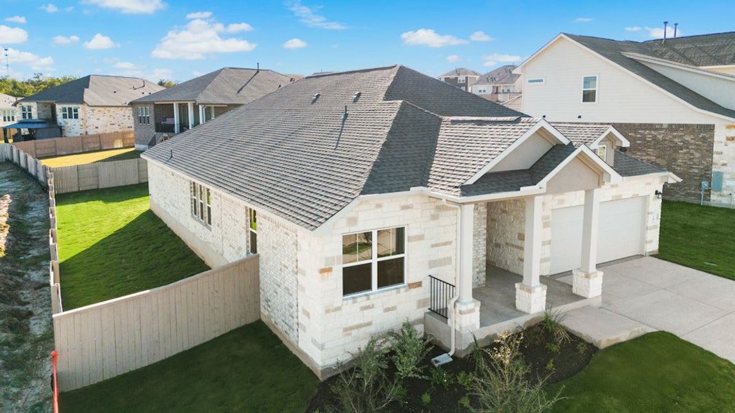 Exterior details and patio area of a home in The Colony, Bastrop (Image 3).