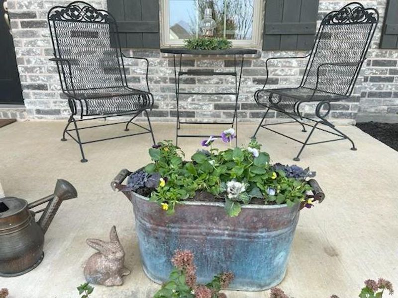 Exterior details and patio area of a home in Ashford Park - Cottage Series, Corinth (Image 2).