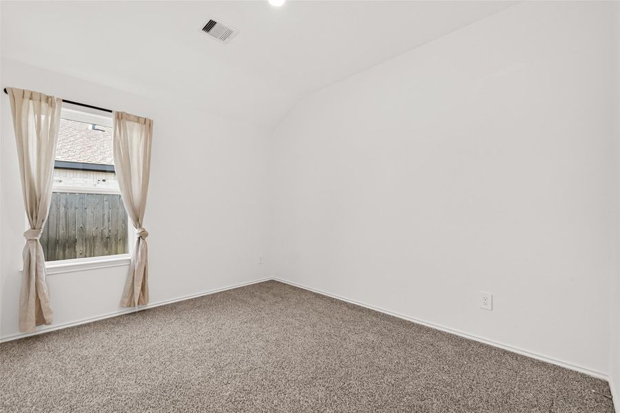 Spacious, unfurnished interior of a new home in Sunterra, Katy (Image 20).