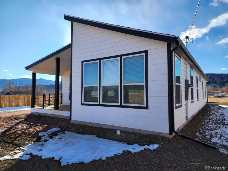 Front exterior of a new home in , Cañon City, CO, highlighting curb appeal (Image 1).
