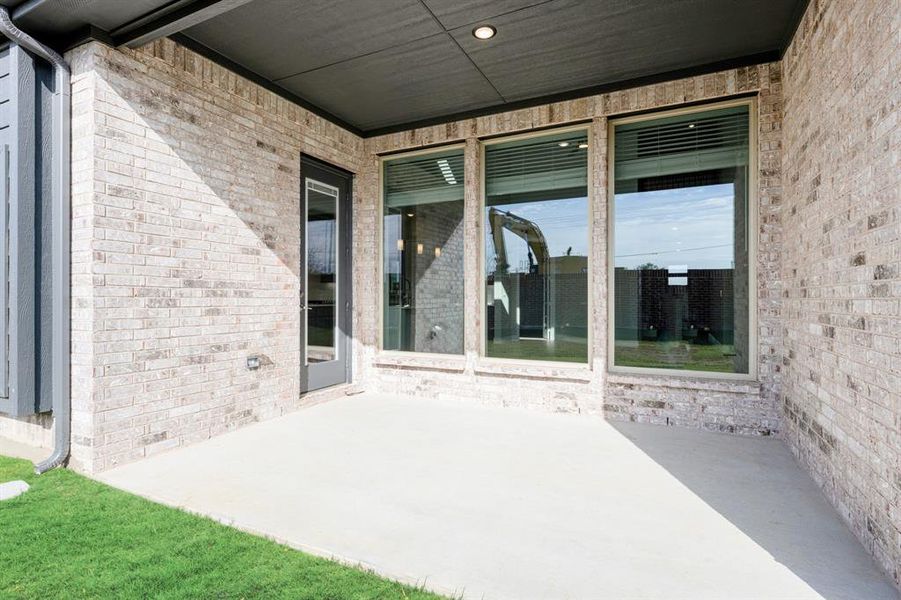 Exterior details and patio area of a home in Creekview Meadows, Pilot Point (Image 28).