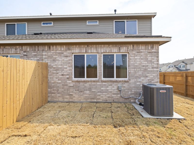 Exterior details and patio area of a home in Saddle Creek Twinhomes, Georgetown (Image 3).
