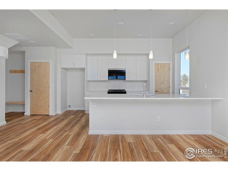 Birch doors, maple window sills, and luxury vinyl flooring