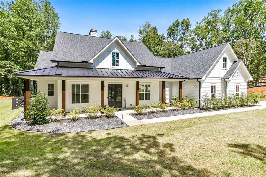 Front exterior of a new home in , Woodstock, GA, highlighting curb appeal (Image 25).