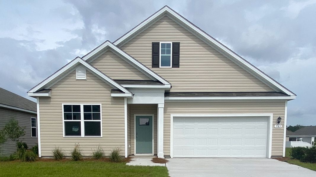 Front exterior of a new home in Stanbury Creek, Supply, NC, highlighting curb appeal (Image 1).