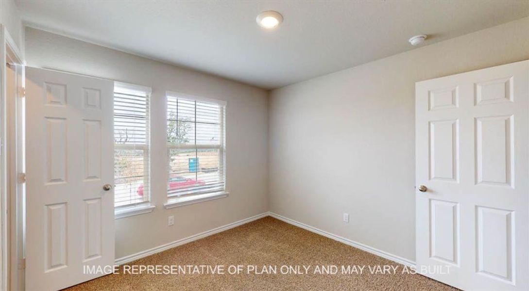 Carpeted spare room with baseboards Carpeted spare room with baseboards